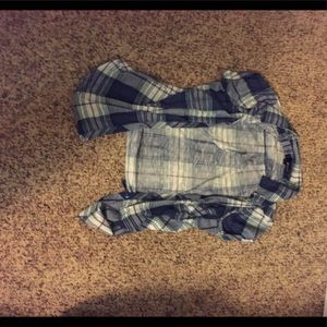 Blue plaid button up shirt.